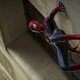Spider-man hanging off a wall.
